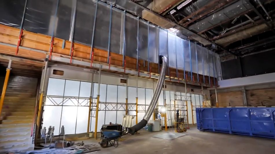 Inside the Fremantle high rise demolition project showing a large silver pipe and various bits of preparatory equipment