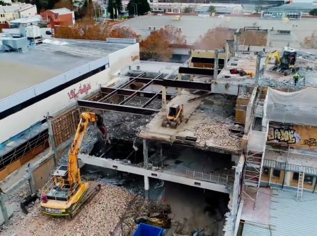 Rubble and scaffolding at the Fremantle high rise demolition site showing the stories being taken apart with machinery on each level