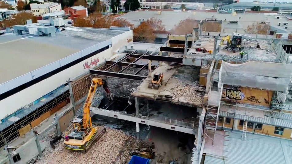 Rubble and scaffolding at the Fremantle high rise demolition site showing the stories being taken apart with machinery on each level