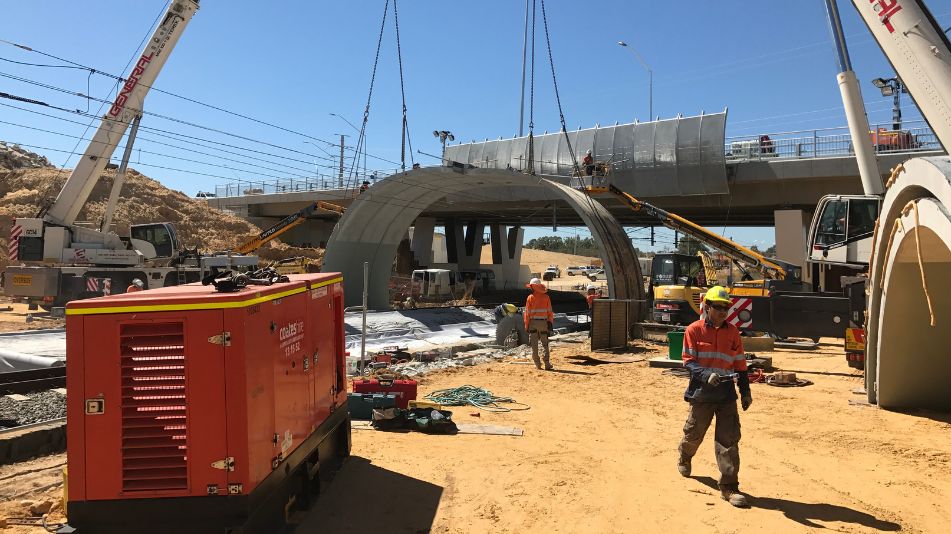 Focus Demolition workers at the Mitchell Freeway Bridge Demolition over the Joondalup line railway during works.