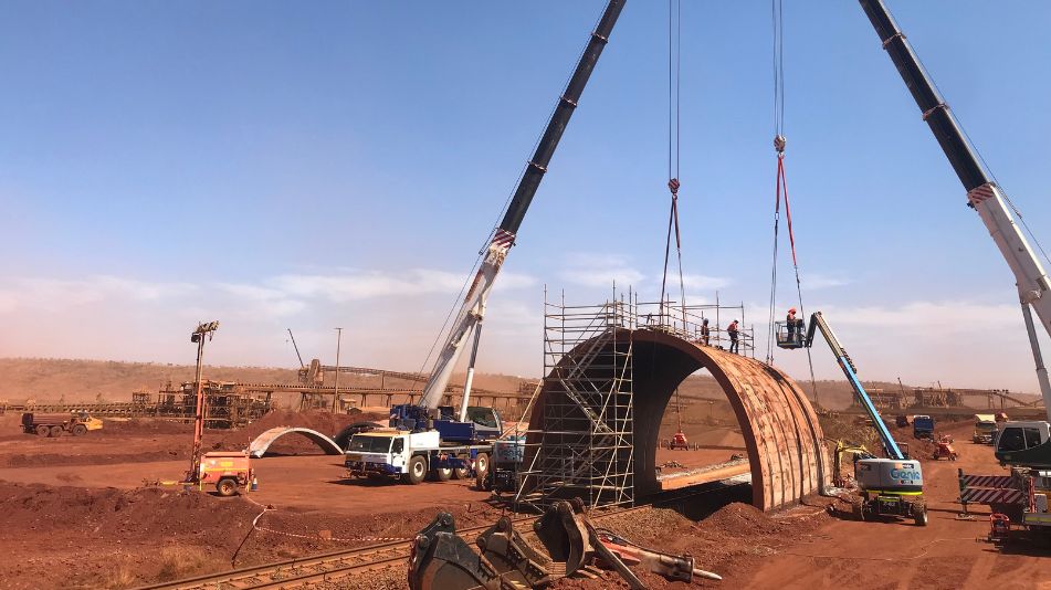 Demolition of rail tunnel bridge in an operating live mine site.