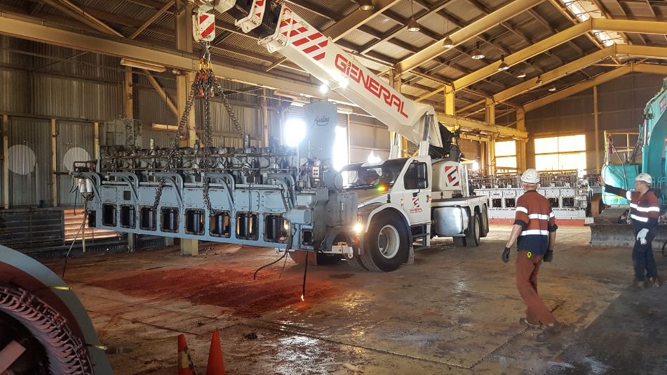 Demolition works from inside the Broome power station showing Focus Demolition workers alongside heavy machinery.